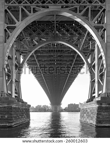 Black and White View from below the Williamsburg Bridge in New York City on a hazy day