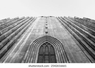 Black and white view of Hallgrímskirkja in Reykjavík, Iceland, looking up from the front door. The minimalist, towering structure and striking lines capture the dramatic essence of this iconic church. - Powered by Shutterstock