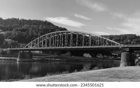 Black and white view of the steel bridge over the river Elbe.