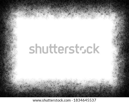 Black and white wall grunge background with dark frame vignette.