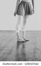 Black And White Wallpaper Faceless Ballet Dancer Warming Up In Studio Copy Space Room For Text. No Face Dancing Female Feet Legs Stretching Indoors Toes Professional Arts. Modern Contemporary Art 