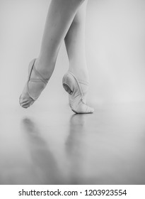 Black And White Wallpaper Faceless Ballet Dancer Warming Up In Studio Copy Space Room For Text. No Face Dancing Female Feet Legs Stretching Indoors Toes Professional Arts. Modern Contemporary Art 