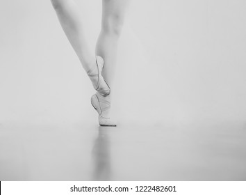 Black And White Wallpaper Faceless Ballet Dancer Warming Up In Studio Copy Space Room For Text. No Face Dancing Female Feet Legs Stretching Indoors Toes Professional Arts. Modern Contemporary Art 