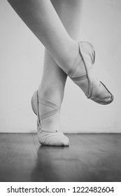 Black And White Wallpaper Faceless Ballet Dancer Warming Up In Studio Copy Space Room For Text. No Face Dancing Female Feet Legs Stretching Indoors Toes Professional Arts. Modern Contemporary Art 