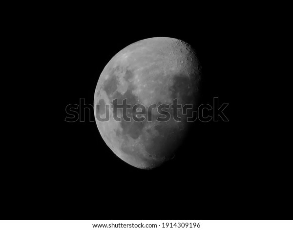 Black and white
waning gibbous moon and
craters