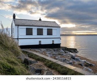 The black and white Watch House at sunrise at Lepe on the edge of The Solent - Powered by Shutterstock