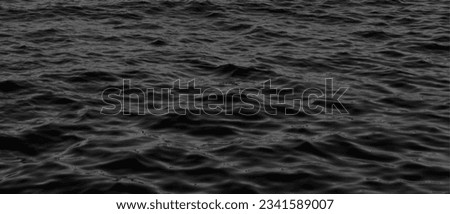 Black and white water texture. background for design.Abstract Dark Water Surface. water texture. water reflection texture background. Dark background, High resolution background of dark oil.