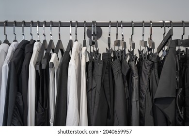 Black And White Woman Clothes In Black Metal Rack Wardrobe Or The Closet Interior Decoration Of Architecture Of Modern Home Contemporary. Concept New Fashion Life Style.