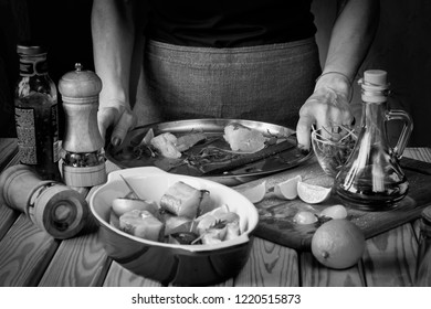 Black And White, Woman Is Cooking Fish. Cooking. Restaurant, Home Cooking.