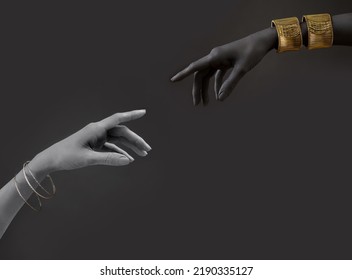 Black and white woman's hands with gold jewelry. Oriental Bracelets on a hand. Gold and silver Jewelry and luxury accessories on black background closeup. High Fashion art concep - Shutterstock ID 2190335127