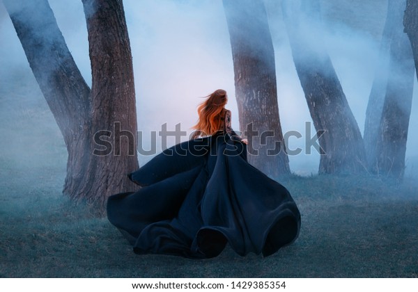 black widow long dark silk fly fabric dress,\
scary horror woman red hair runs mystery forest turned away black\
lady night walk gothic blue fog nature tree. art photo shoot\
mysterious woman\
silhouette