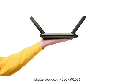 black wifi router on female hand  isolated on  white background - Shutterstock ID 2307591561