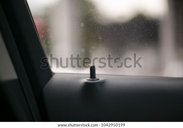 Black window\
safety car lock on the car\
window