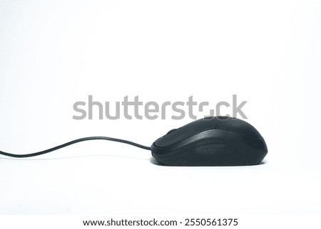 Black wired computer mouse isolated on a clean white background. Minimalist design, perfect for office, workplace, and technology concepts.