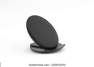 Black wireless charger for mobile phone isolated