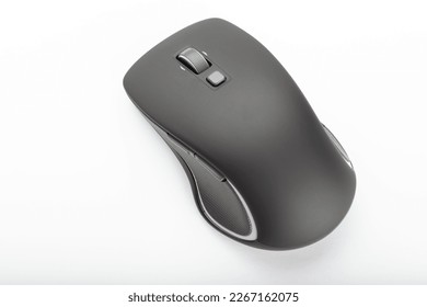 Black wireless computer mouse on a white background. Accessories for computer equipment