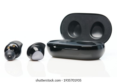 Black Wireless Earphones With Charging  Case Isolated On White Background