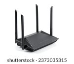 Black wireless internet router isolated on white background. Wireless Wi-Fi router isolated on white. Fiber Optic Internet. Network cables Connected to a router, speed test concept.