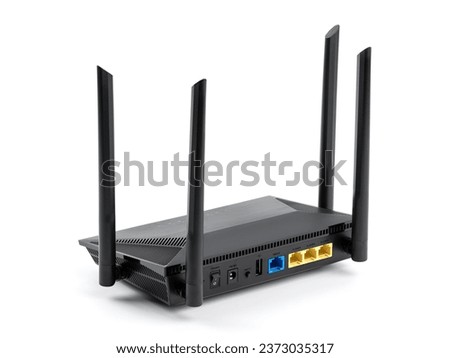 Black wireless internet router isolated on white background. Wireless Wi-Fi router isolated on white. Fiber Optic Internet. Network cables Connected to a router, speed test concept.