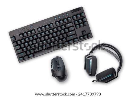 Black wireless keyboard, mouse and headset, isolated on white background.
