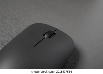 Black Wireless Mouse Close Up On A Dark Background