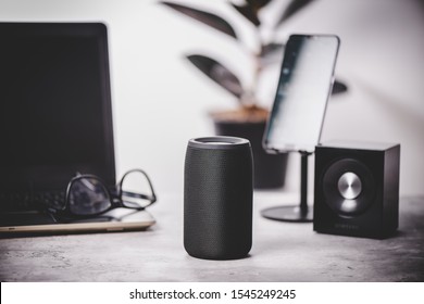 Black wireless portable bluetooth speaker for music listening. Voice assistant speaker at home. - Shutterstock ID 1545249245