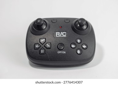 Black Wireless Remote Control for RC Drone or Helicopter Toy Isolated on White Background