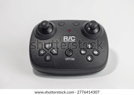 Black Wireless Remote Control for RC Drone or Helicopter Toy Isolated on White Background