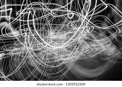 Black and withe abstract play of light- parallel oval shapes