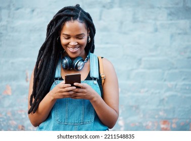 Black Woman With 5g Smartphone For Social Media Typing, Digital Chat App Or Check Location On Blue Wall Background Space Mockup. Teenager Gen Z Girl On Cellphone For Youth Online Website Networking