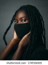 Black Woman In African Dreadlocks With Mask Covering Nose. Signifies The Unheard Voices Of Black People And Black Women. 