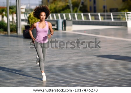 Similar – Black woman afro hairstyle running outdoors in urban road