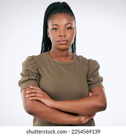 Black woman, arms crossed and standing isolated on gray background for confident profile or empowerment. Portrait of African American female model with serious face for leadership or management - Shutterstock ID 2254569139