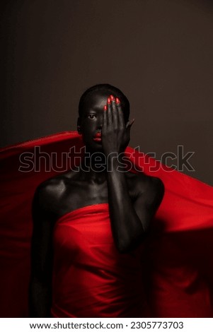 Black woman in art with red magazine