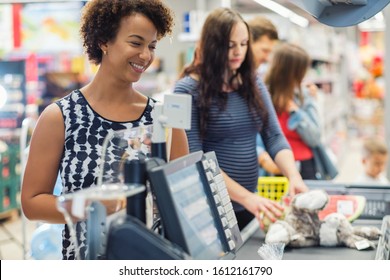 Black Woman Buying Goods In A Grocery Store