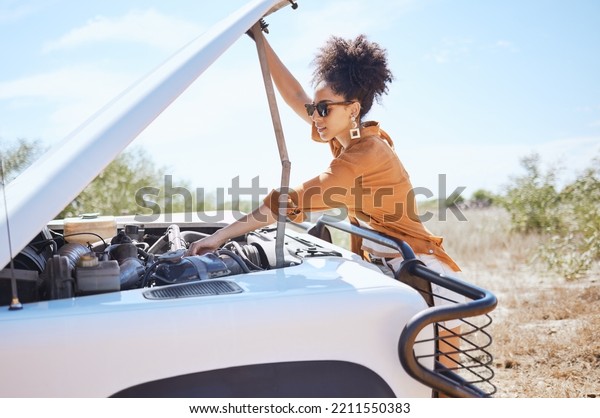 Black woman car engine problem on road\
trip or outdoor holiday travel journey in Africa. Girl driver stop\
traveling, vacation and accident emergency assistance try fix or\
repair motor\
transportation