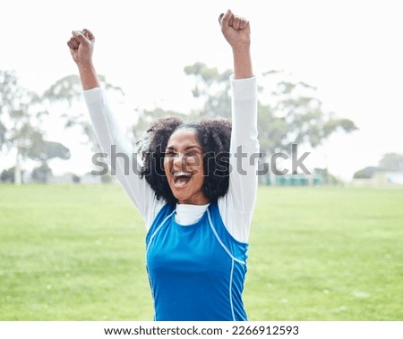 Black woman, celebration and smile for winning, success or sports victory and achievement on grass field outdoors. Happy African American female smiling and celebrating win, goal or accomplishment