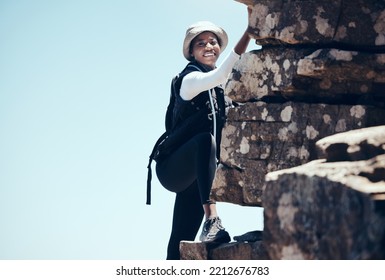 Black Woman, Climbing A Rock Mountain And Adventure In Nature For Healthy Exercise Or Sport Workout. African American Female In Sports Fitness With Smile For Summer Rocky Climb In South Africa