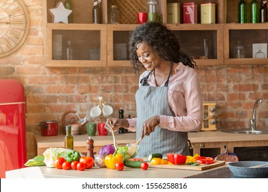 Black Woman Cooking Healthy Vegetarian Salad At Kitchen