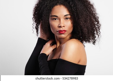 Black Woman With Curly Hair And Bright Red Lips