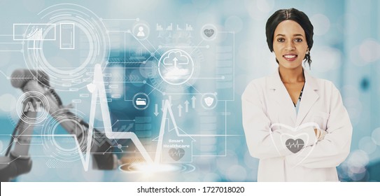 black woman doctor smiling,medical icon and hospital background,futuristic smart healthcare and robot arm medical technology concept,control by artificial intelligence and counseling hospital to house - Powered by Shutterstock