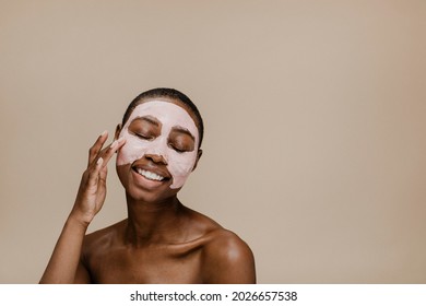 Black Woman Doing A Face Mask