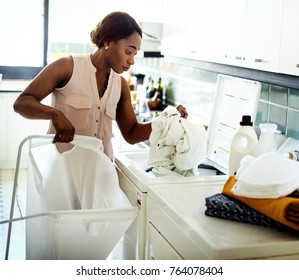 Black Woman Doing The Laundry