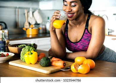 Black Woman Is Drinking Orange Juice