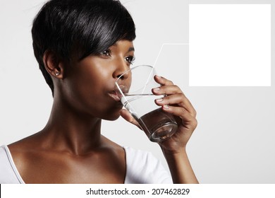 Black Woman Drinking Water. Note To A Water In Glass  