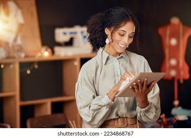 Black woman, fashion designer and tablet for planning, internet and web ideas in textile studio. Happy tailor, digital technology and manufacturing startup, small business owner and creative workshop