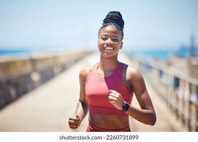 Black woman, fitness and running with smile for workout, cardio exercise or training in the outdoors. Happy African American female runner smiling in run, exercising or marathon for healthy lifestyle - Powered by Shutterstock