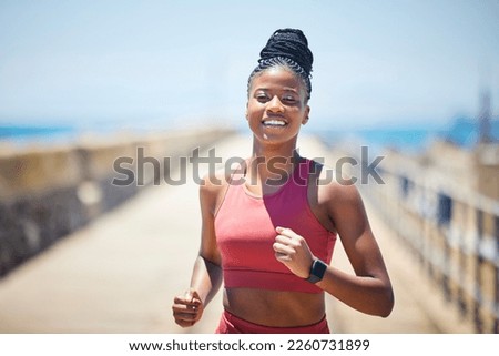 Black woman, fitness and running with smile for workout, cardio exercise or training in the outdoors. Happy African American female runner smiling in run, exercising or marathon for healthy lifestyle