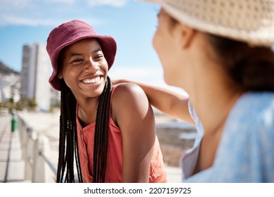 Black Woman Friends At The Beach In An Urban City For Summer, Vacation Or Holiday With Sunshine In Miami. Happy Travel Couple Or Gen Z People With Smile For Outdoor Vitamin D Near Ocean