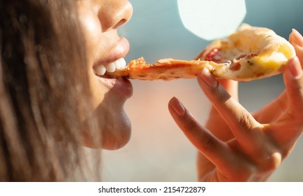 Black Woman Hand Takes A Slice Of Meat Pizza. Young Woman Eating Pizza Outdoor In Street.